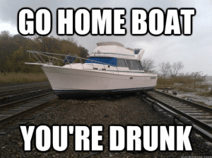 Boat on railroad tracks with text "Go home boat, you're drunk"