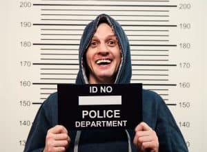 World's worst criminal smiling for his mug shot